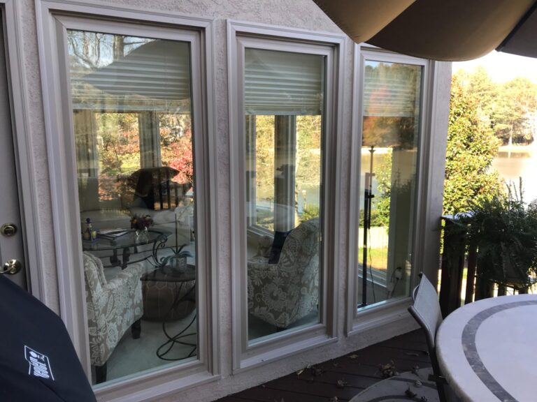 Double-hung vinyl windows from the 700 Series, showcasing energy-efficient glass and low-maintenance design, installed in a home setting with visible outdoor view.