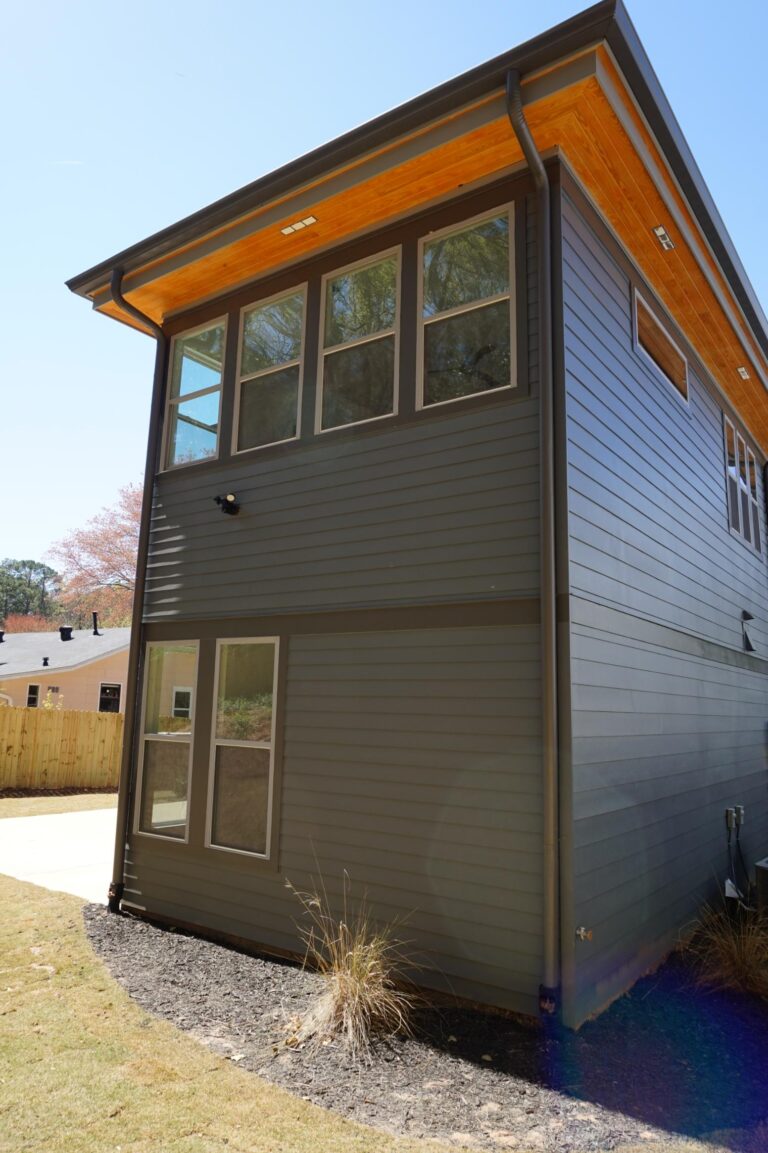Single-hung vinyl window installation on modern home exterior, showcasing energy-efficient design and custom sizing options from Windowcrafters.