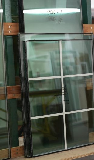 Vinyl window glass panel featuring grid pattern, part of the 900 Series, showcasing in-house glass production at Windowcrafters in Tucker, GA.